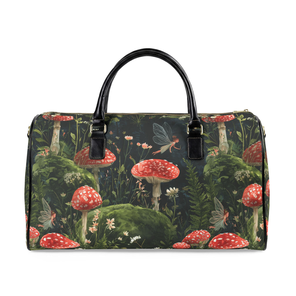 A duffle bag with a dark forest and fairy tale woodland print featuring red and white mushrooms, green moss, and a fairy, with black leather handles, shown on a plain white background.