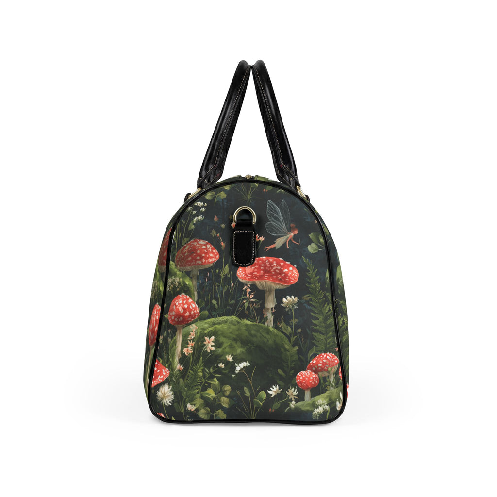 A structured handbag with a dark forest and mushroom print, featuring red-capped mushrooms, a fairy, and green foliage, with black leather handles and trim.