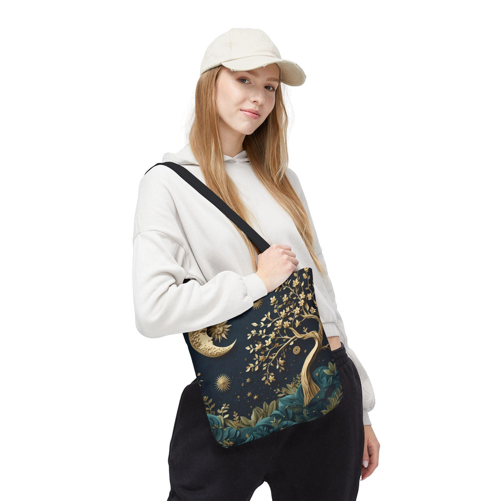 Woman wearing cap carrying Celestial Moon Tree of Life Tote Bag — boho witchy navy canvas tote with gold tree design

