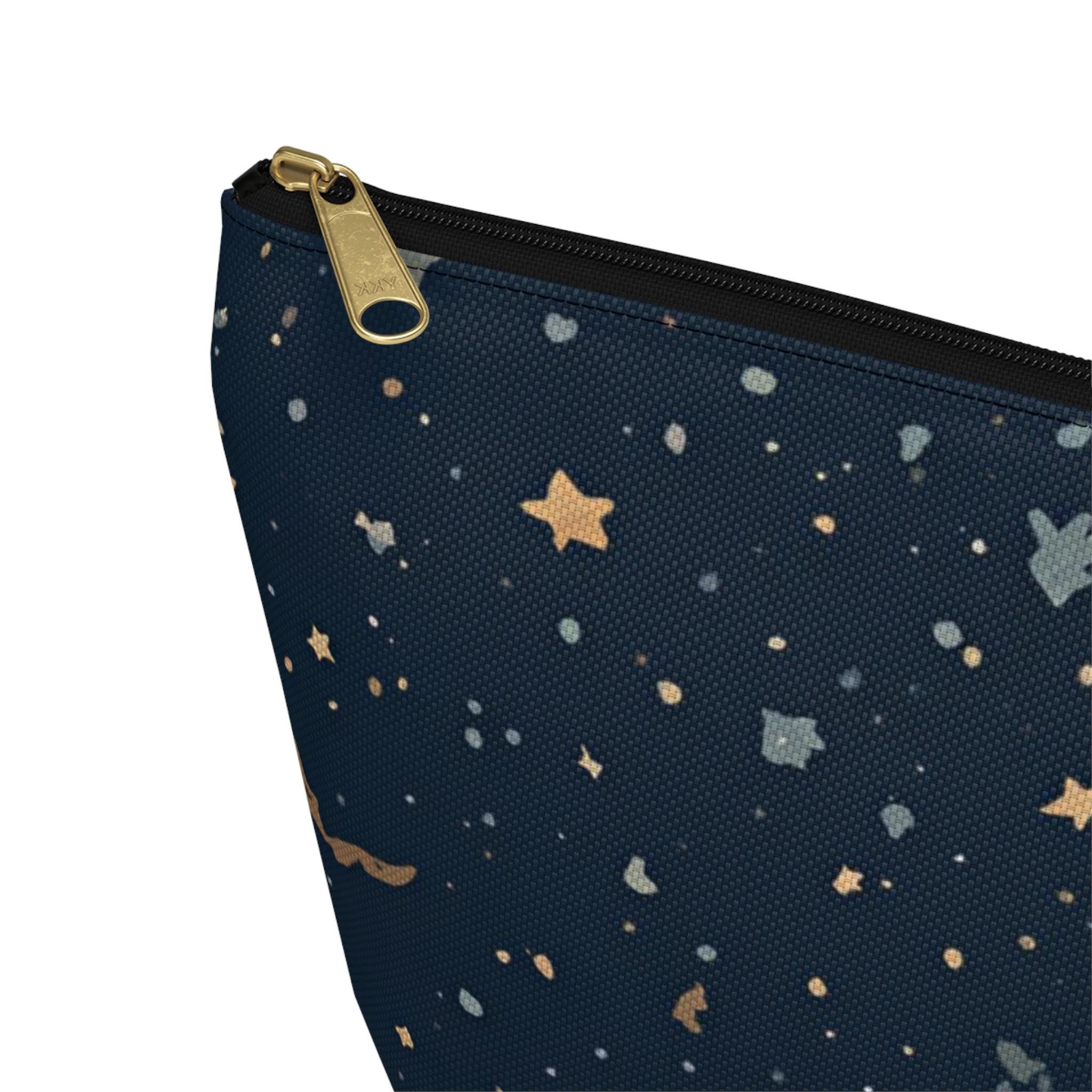 Celestial moon and stars T-bottom cosmetic pouch front view — navy blue with gold star and crescent moon print

