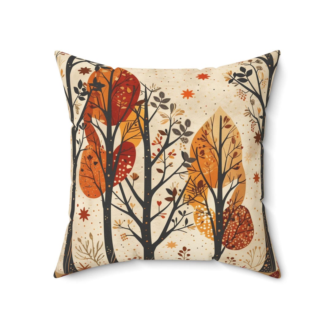 Autumn trees throw pillow shown on a lounge chair