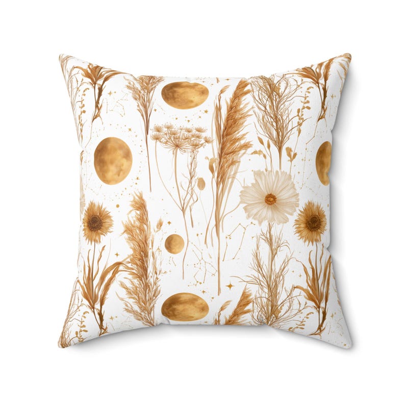 Golden wildflower and moon pattern boho throw pillow styled on a cream sofa