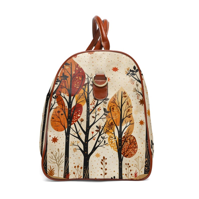 Autumn forest duffle bag side view showing fall leaves design