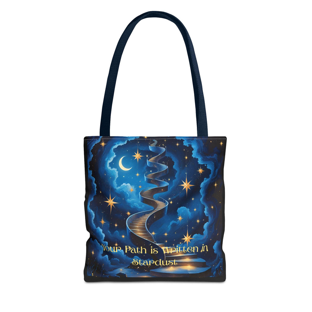 Cosmic Stardust Tote Bag flat lay — deep blue celestial design with gold stars, crescent moon, winding stardust path, and "Your Path is Written in Stardust" script, black handle