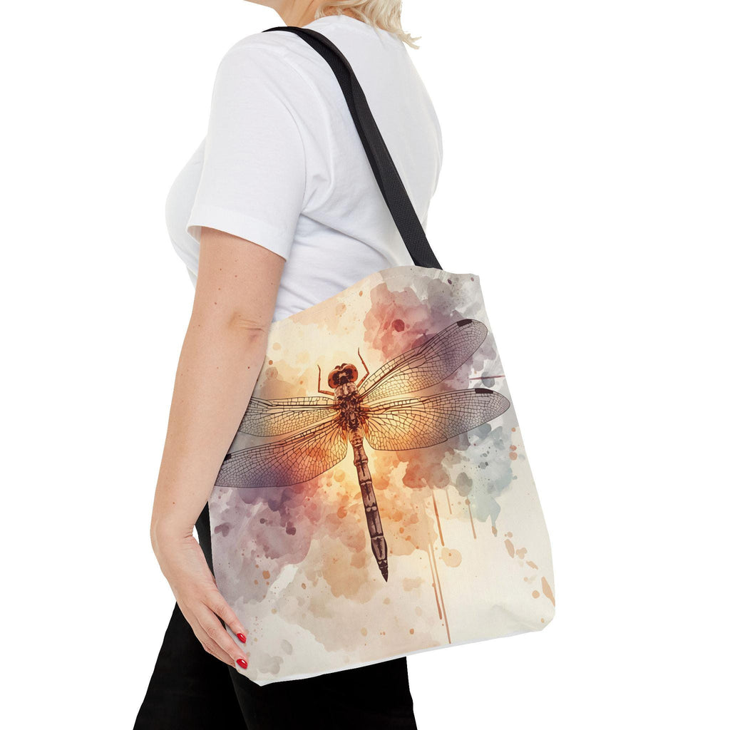 Woman wearing Watercolor Dragonfly Tote Bag — vintage dragonfly illustration on soft watercolor wash background in cream, blush, and sage tones