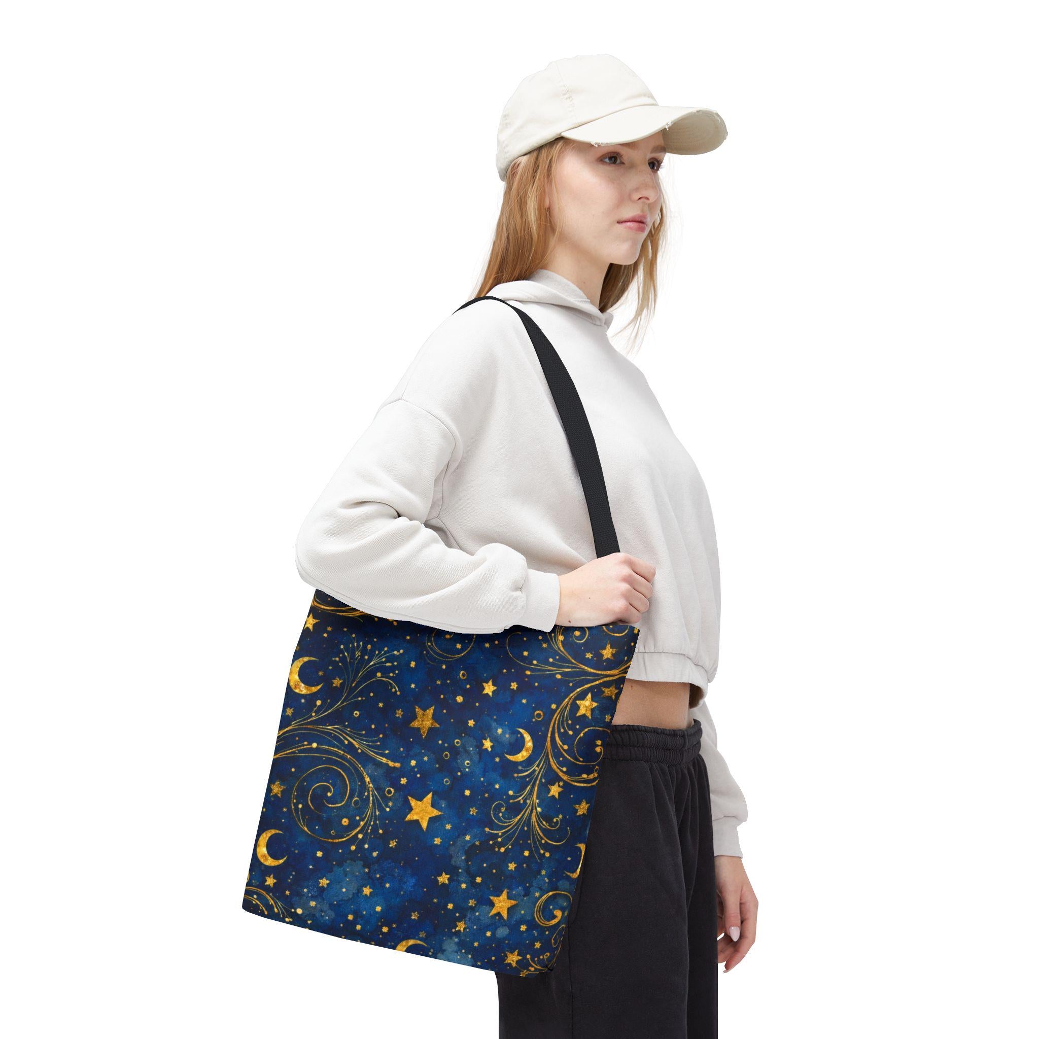 Woman wearing cap carrying Celestial Navy Blue Tote Bag — gold stars and moon swirl pattern, boho night sky canvas tote
