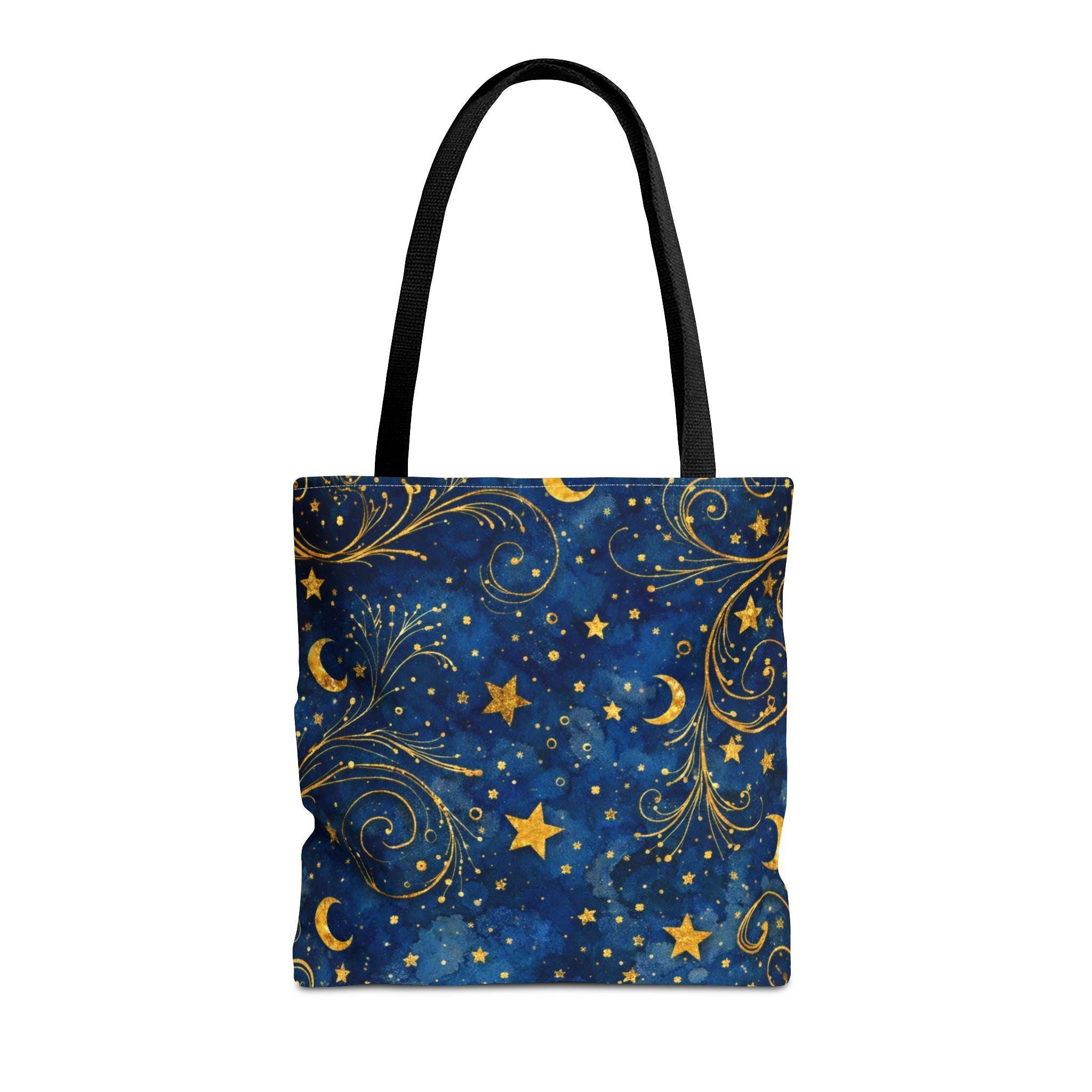 Celestial Navy Blue Tote Bag flat lay — gold stars moons and swirls pattern on deep blue canvas, black handle