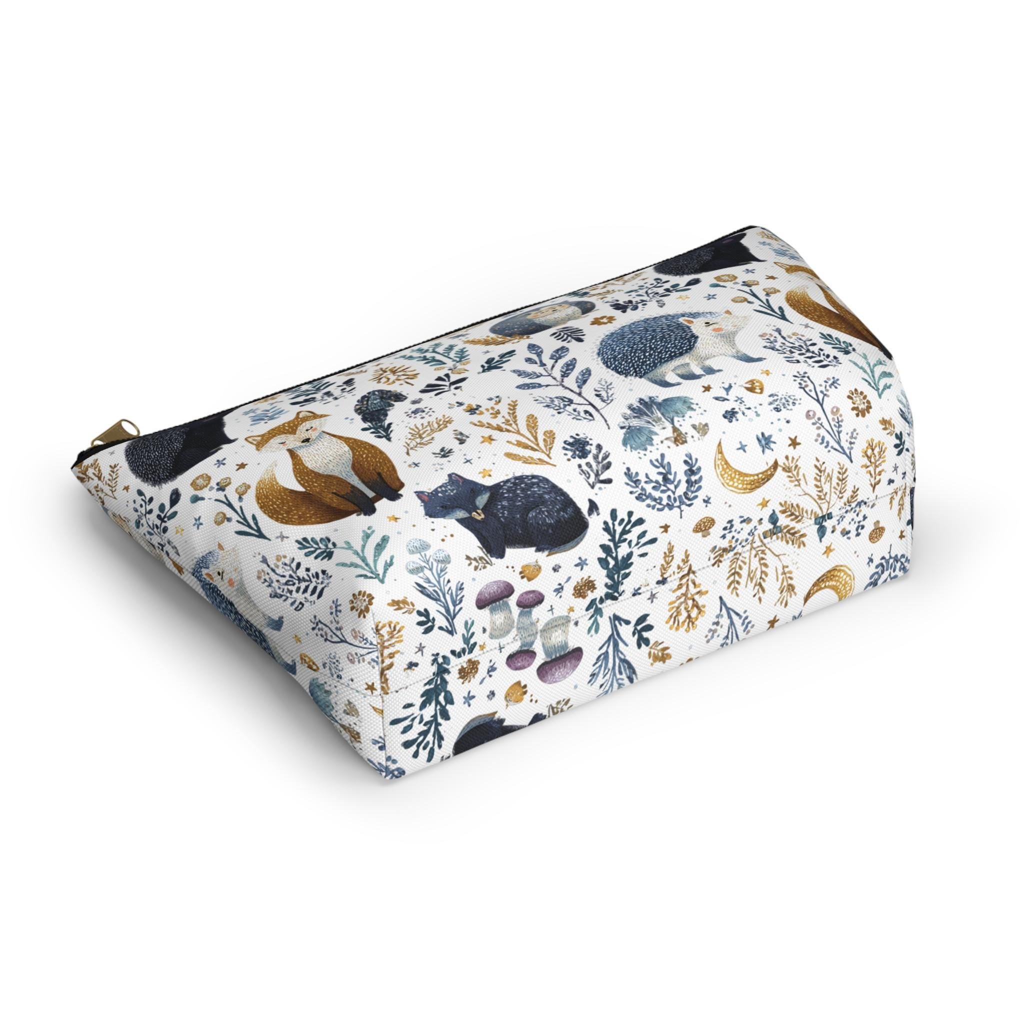 Pouch with nature-themed design featuring animals and plants on a white background