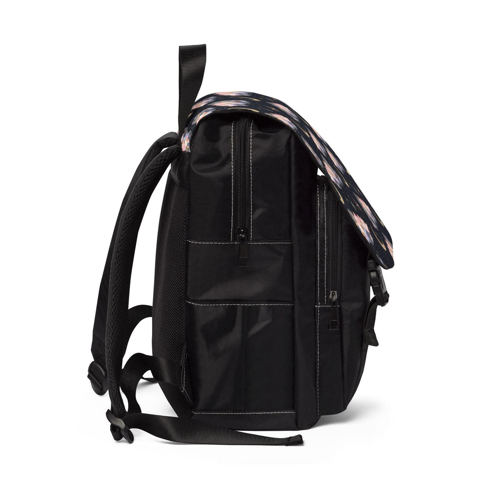 Black backpack with brown leather accents on a white background