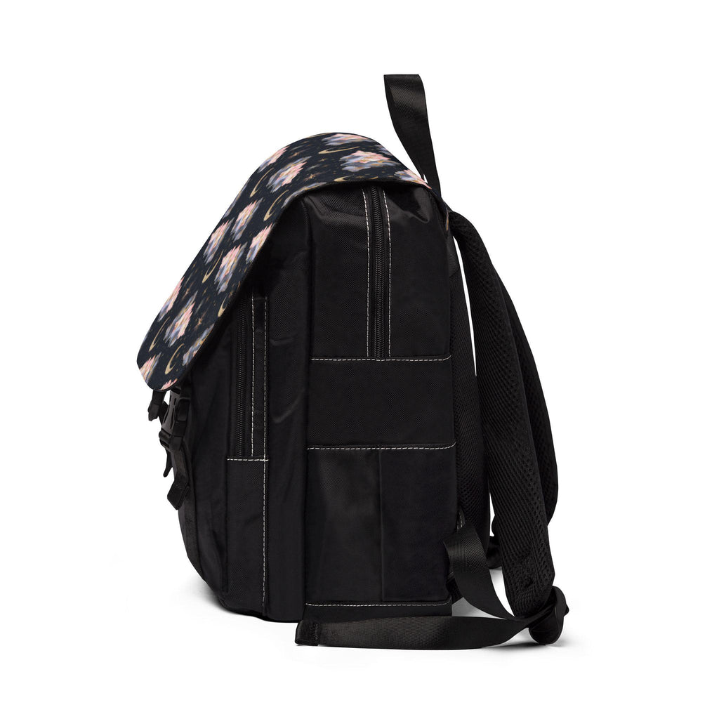 Black backpack with floral pattern on the flap, side view on a white background